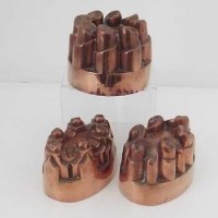 Lot 14 - Circular copper mould and two oval moulds No.