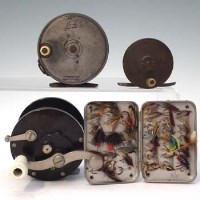 Lot 20 - Penn Bakelite Reel, Hardy Perfect reel, A&N brass reel, tin of flies