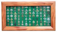 Lot 88 - Large framed display of cap badges.
