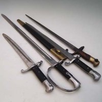 Lot 95 - Saw back bayonet, 1887 sword bayonet, a cut down