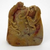 Lot 120 - Brownish grey jade carved boulder of a mountain with a lion and