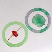 Lot 137 - Two Chinese jade bangles; jade brooch; 9ct gold