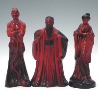 Lot 148 - Royal Doulton flambe geisha, genie and confucuis