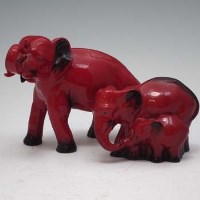 Lot 151 - Royal Doulton Flambe elephant group and a single elephant
