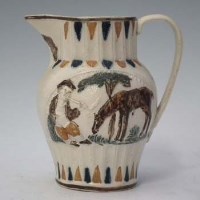 Lot 211 - Pratt ware jug.