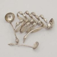 Lot 417 - Eight silver swan neck napkin rings and three ladles