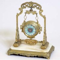 Lot 8 - Brass Chinoiserie swing clock.