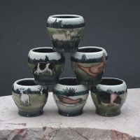 Lot 201 - Six Moorcroft egg cups.