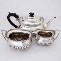 Lot 241 - Three piece silver tea set.