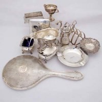 Lot 255 - Silver three-piece condiment set; toast rack; ashtray; sauce boat; cigarette case; bon-bon dish; trophy; mirror and box.