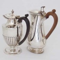 Lot 274 - Two London silver hot water jugs