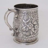 Lot 278 - Early Georgian silver mug with later embossing