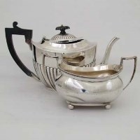 Lot 279 - Silver half-reeded teapot and a silver