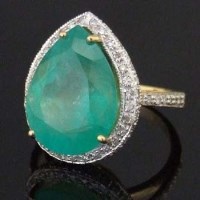 Lot 290 - Pear-shaped emerald and diamond ring, the