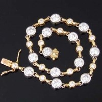 Lot 308 - Gold and diamond line bracelet.