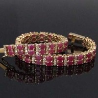 Lot 327 - Yellow metal ruby and diamond bracelet.