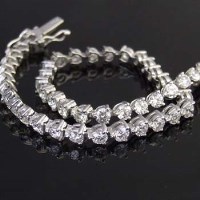 Lot 355 - 18ct white gold and diamond line bracelet of 46