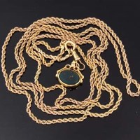 Lot 364 - 9ct gold rope twist muff chain with fob
