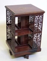 Lot 649 - Edwardian mahogany revolving square bookcase banded in satinwood