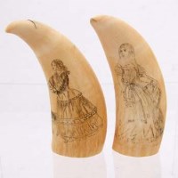 Lot 41 - Two scrimshaw ivory teeth