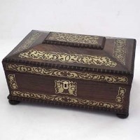 Lot 62 - Rosewood and foliate brass casket shape box.