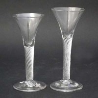 Lot 138 - Two mercury twist wine glasses.