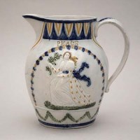 Lot 139 - Pratt ware Peace and Plenty jug.