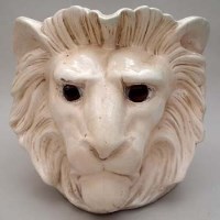 Lot 189 - Bretby Lion jardiniere with glass eye.