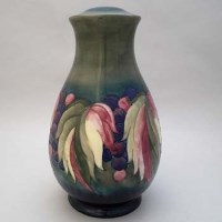 Lot 207 - Moorcroft leaf and berries pattern vase.