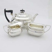 Lot 252 - Walker & Hall silver three piece tea set.