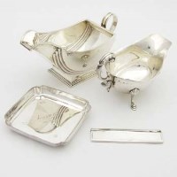 Lot 255 - Art deco silver sauce-boat; geo style sauce-boat; silver ashtray; silver mounted comb.