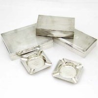 Lot 260 - Three silver cigarette boxes and two silver ashtrays.