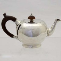 Lot 272 - Silver bullet shaped teapot.