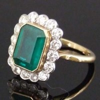 Lot 285 - 18ct gold emerald and diamond ring.