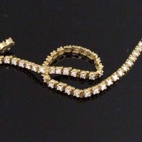 Lot 321 - 18ct gold and diamond line bracelet.