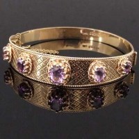 Lot 328 - Victorian style 9ct gold and amethyst bangle.