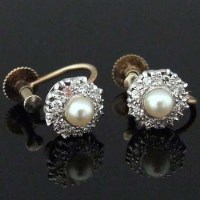 Lot 335 - Pearl of pearl and diamond screw earrings.