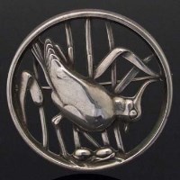Lot 358 - Georg Jensen silver circular brooch of a crested