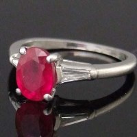 Lot 377 - Ruby and baguette diamond platinum ring