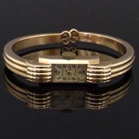 Lot 395 - 9ct gold lady's Rotary bangle wrist watch.
