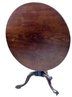 Lot 656 - George III mahogany circular tip top table