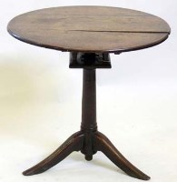 Lot 658 - George III oak top top birdcage table.