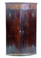 Lot 711 - Early Victorian mahogany bow fronted wall hanging corner cupboard