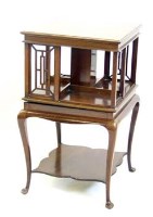 Lot 737 - Edwardian mahogany revolving book table