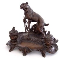 Lot 11 - Spelter 2 bottle inkstand surmounted by dog.