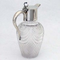 Lot 209 - Cut glass and silver claret jug.