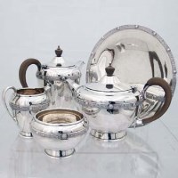 Lot 210 - Four piece silver tea set and comport.