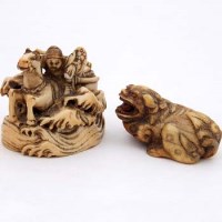 Lot 80 - Netsuke shishi and horse with rider (2).