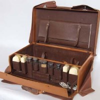 Lot 222 - Silver and ivory leather travelling case.