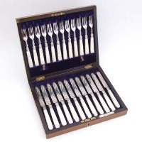 Lot 247 - Silver fruit knife and fork set in oak case.